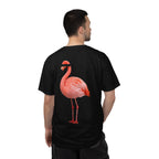 Person wearing a black t-shirt with a pink flamingo design on the back, standing against a white background.