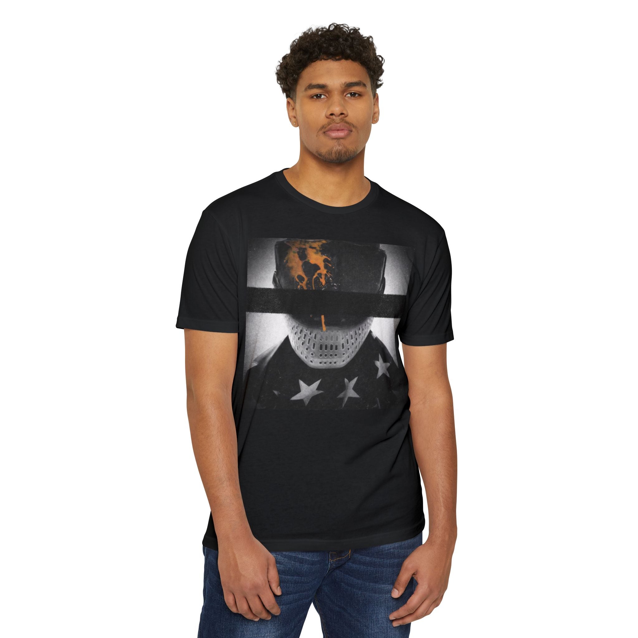 Paintball player wearing gogged shirt with paint splatter mask design and redacted PB branding