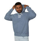 Man wearing a blue hoodie with text, standing against a white background