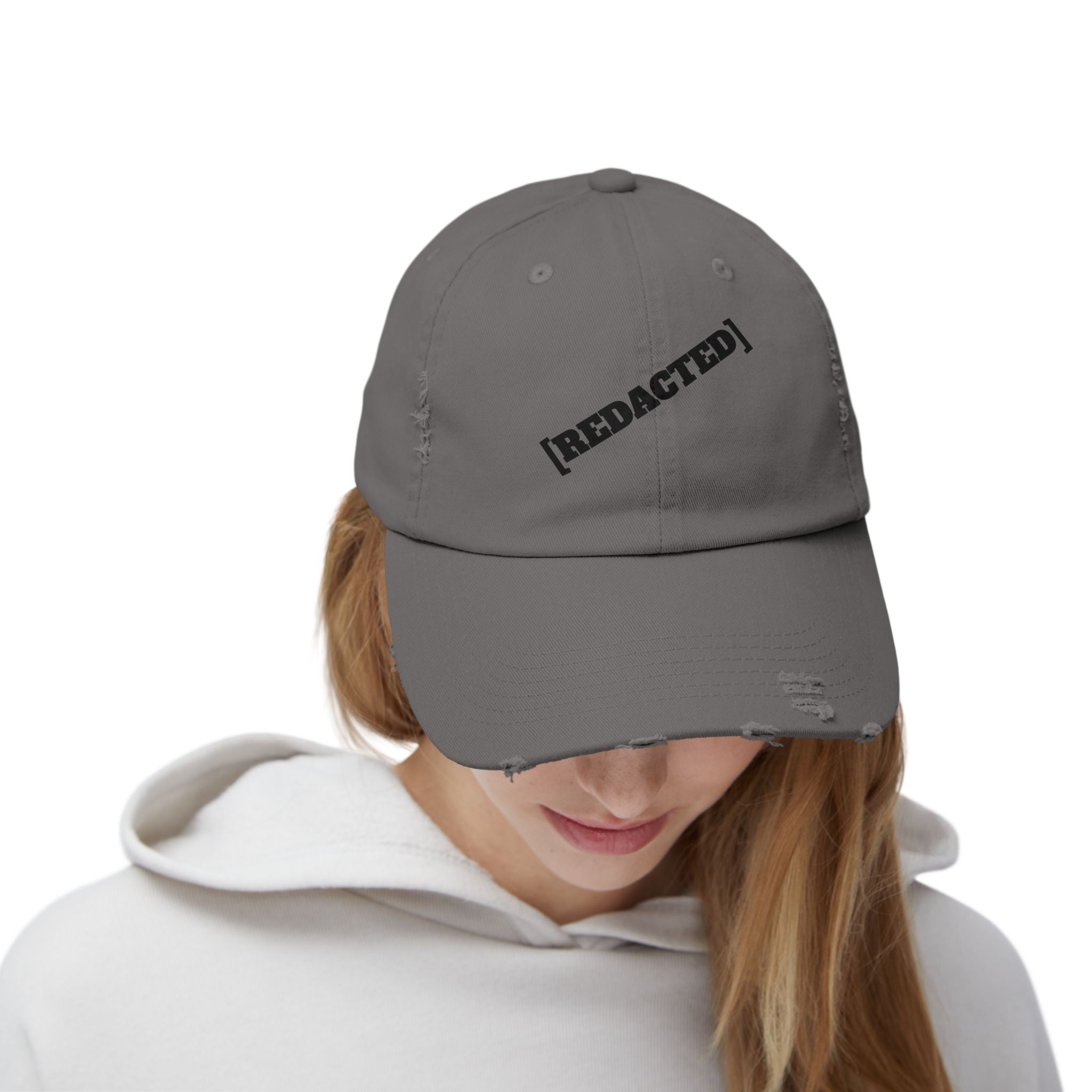 Model wearing gray [REDACTED] strapback hat minimalist style