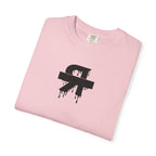 Folded pink t-shirt with a black graphic design on a white background