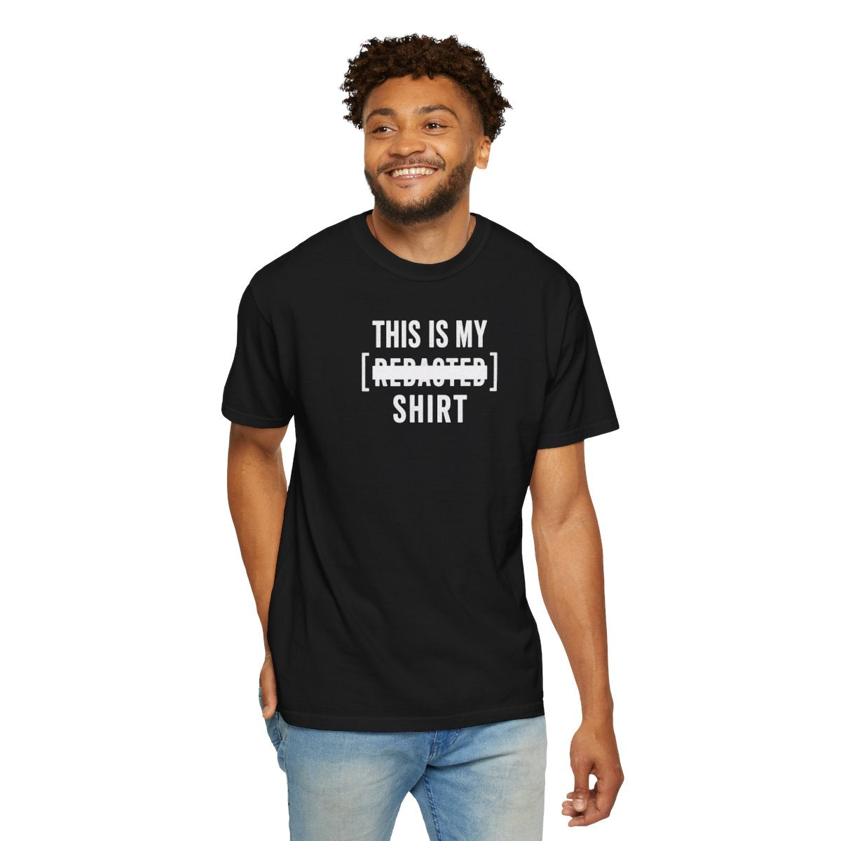 Model wearing black redacted shirt with bold white lettering and clean redaction bar design streetwear style front view