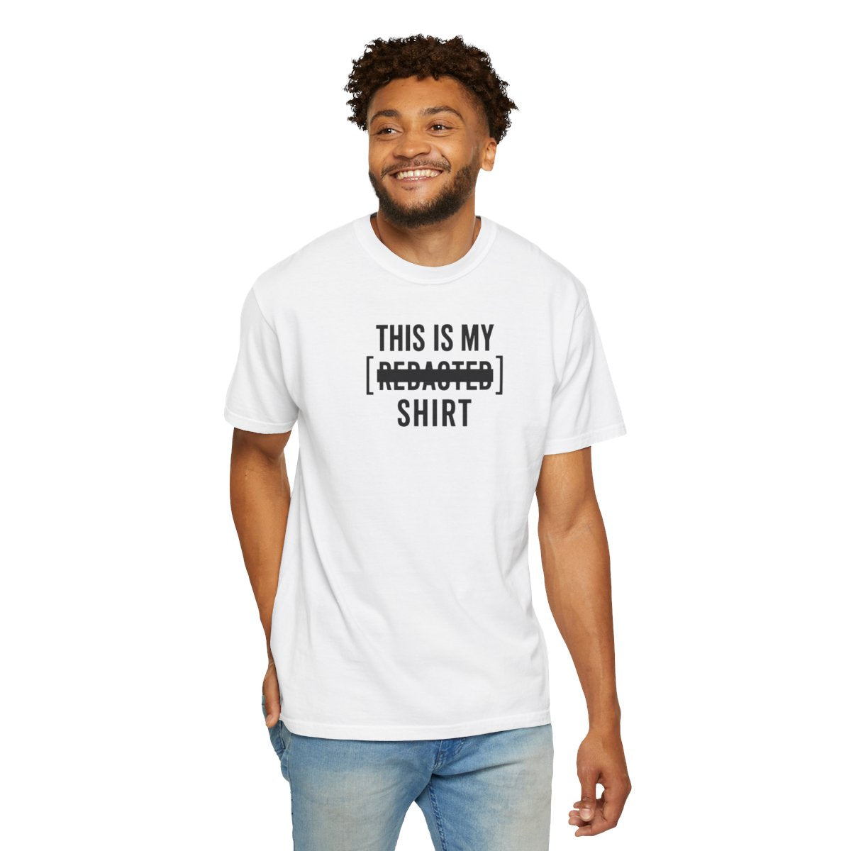 Model wearing white redacted shirt with bold black lettering and clean redaction bar minimalist streetwear design front view

