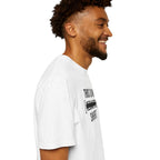 Model wearing white redacted shirt with bold black lettering and clean redaction bar minimalist streetwear design side view